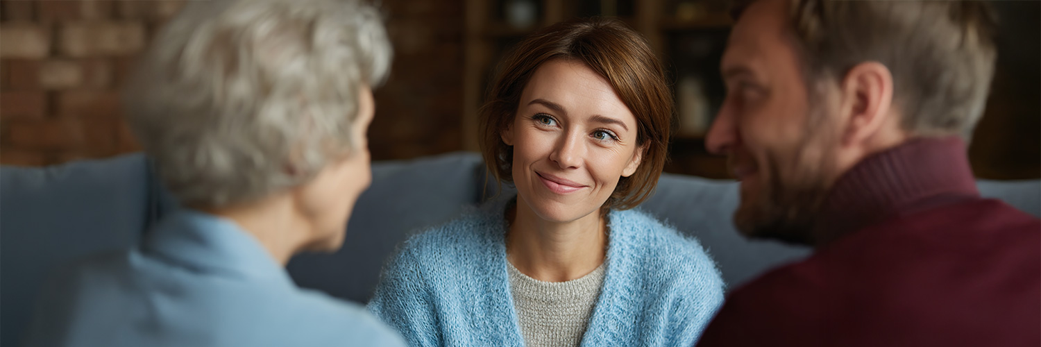 Cherished Moments: A heart-warming portrait of three generations in a cozy indoor setting, sharing laughter, creating a timeless narrative of love and kinship.